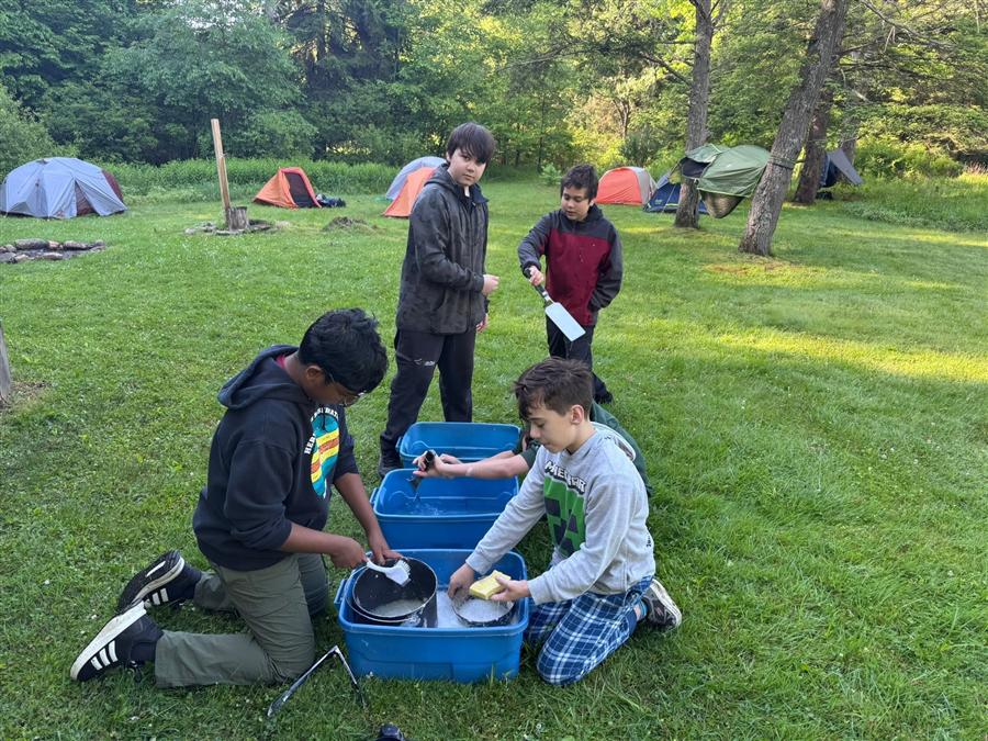Troop 58 Scouts washing dishes at their campsite