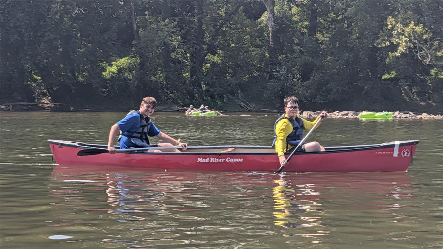 Two Troop 58 Scouts canoeing on a river