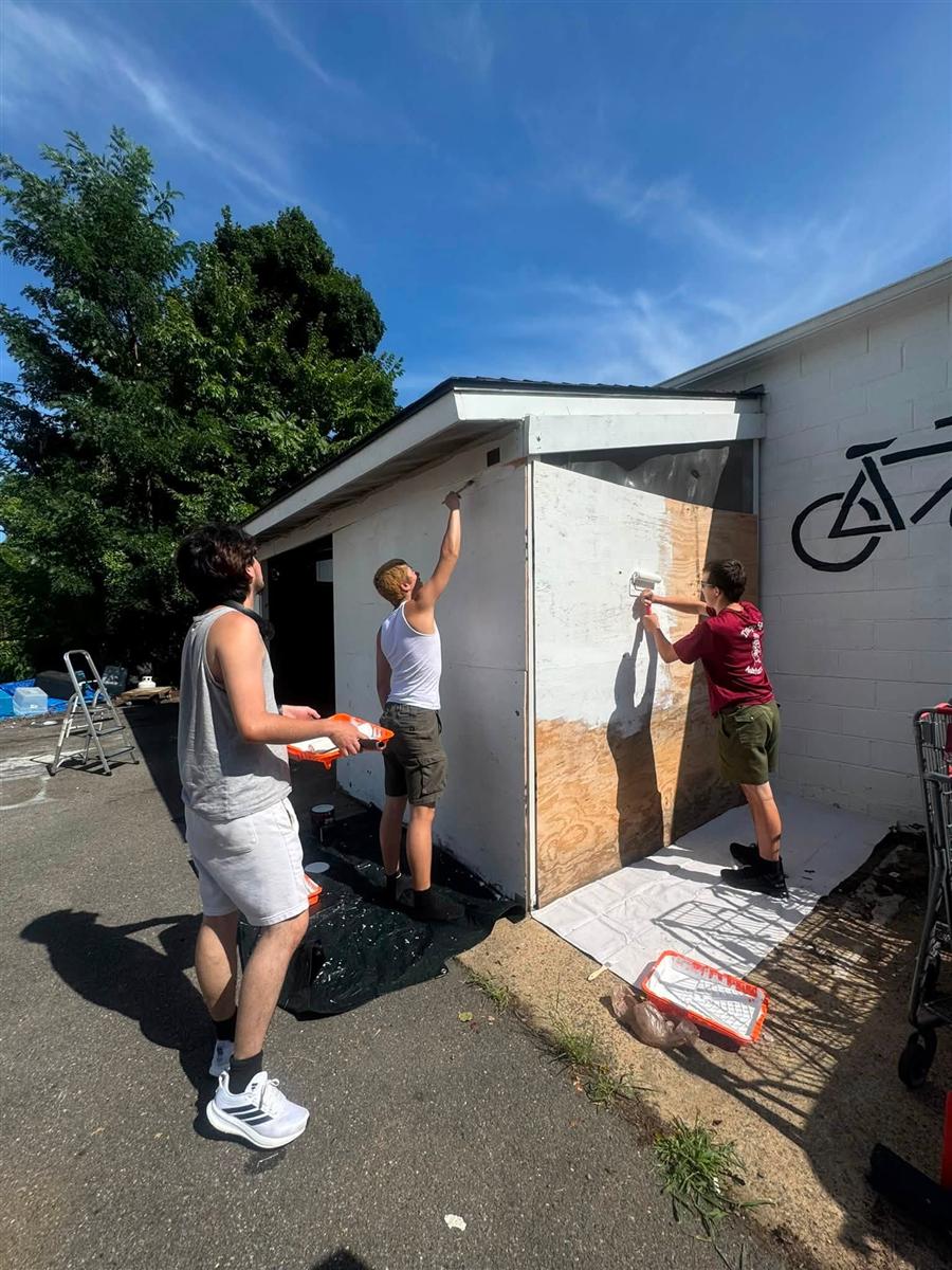 Troop 58 Scouts painting a building as a community service project